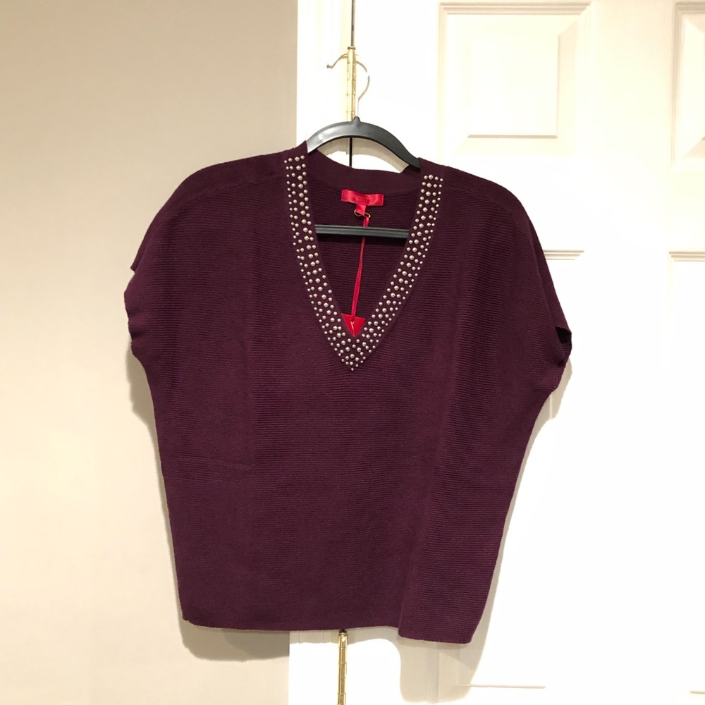 V-neck sweater top.